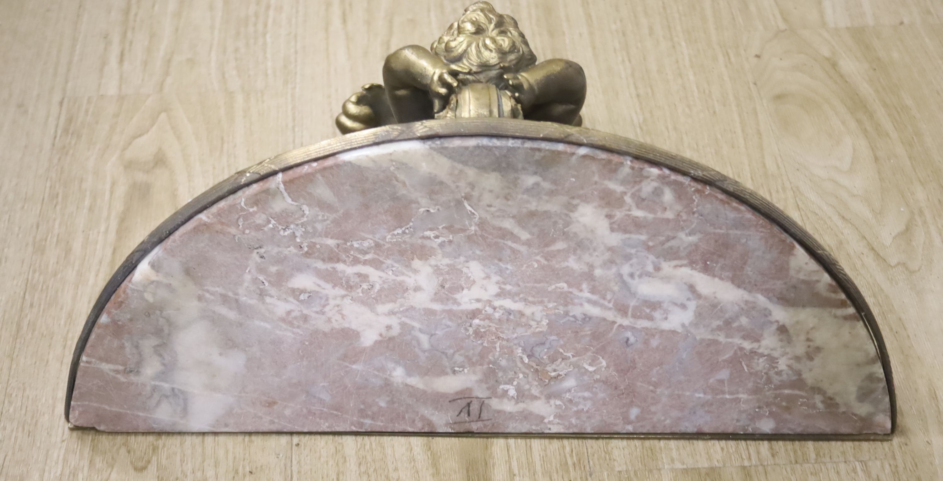 A Louis XV style gilt cast metal marble-topped wall bracket, 52cm wide, 49cm wide